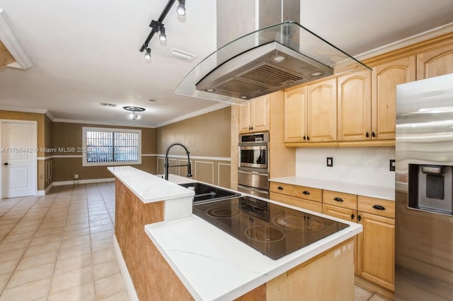 kitchen with stainless steel fridge, a kitchen island, black electric cooktop, and light brown cabinetry