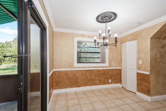 unfurnished dining area featuring an inviting chandelier and crown molding