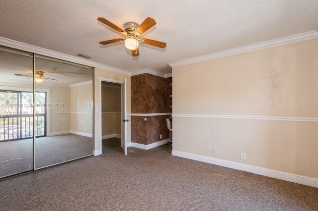 interior space featuring a textured ceiling, a closet, ceiling fan, and crown molding