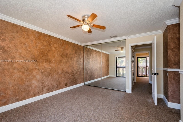 unfurnished bedroom featuring a textured ceiling, a closet, crown molding, and ceiling fan