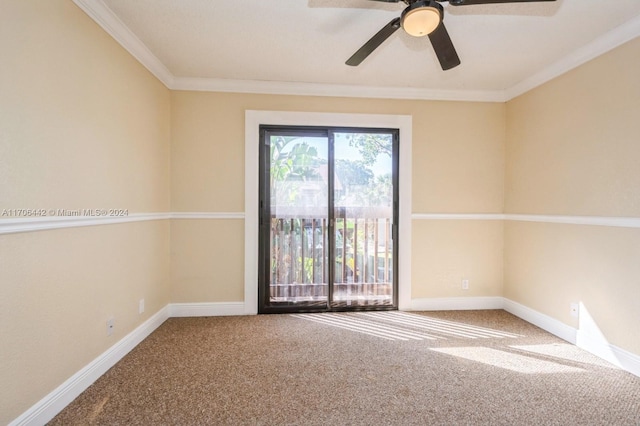 carpeted spare room featuring crown molding and ceiling fan