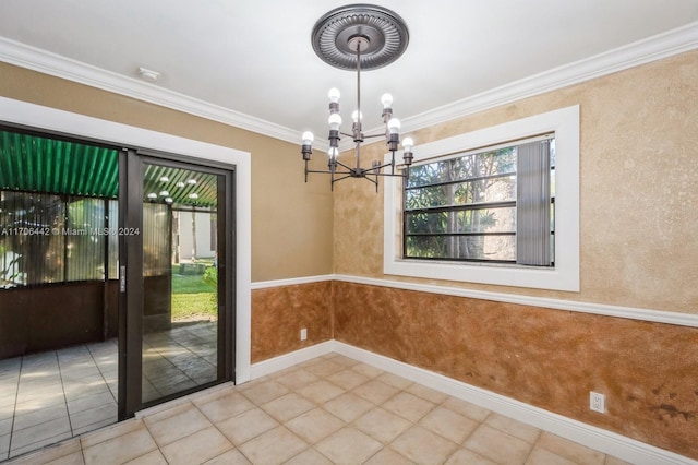 unfurnished dining area featuring ornamental molding and a chandelier