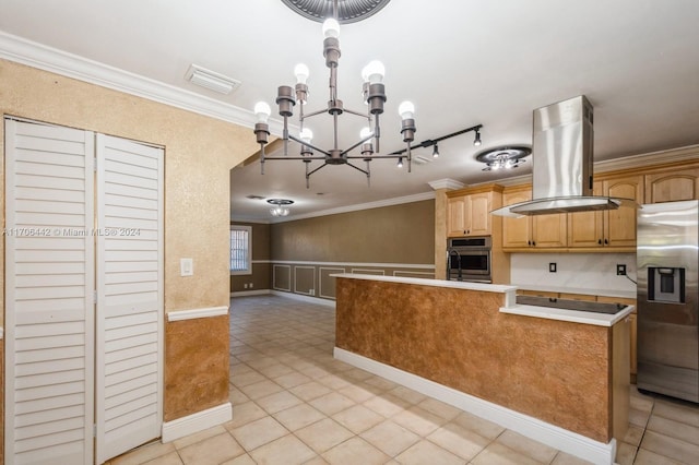 kitchen with light tile patterned floors, ornamental molding, appliances with stainless steel finishes, island exhaust hood, and a chandelier