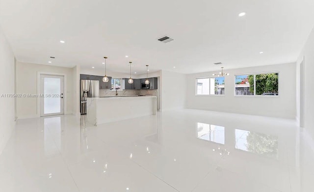 unfurnished living room with light tile patterned floors