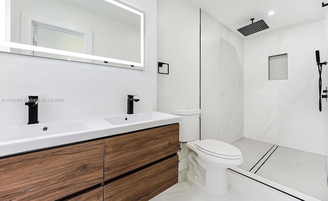 bathroom featuring tile patterned floors, vanity, toilet, and walk in shower