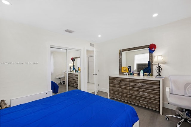 bedroom featuring a closet and hardwood / wood-style flooring