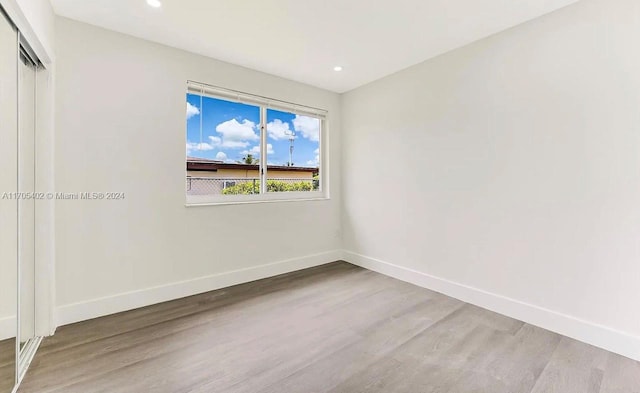 spare room featuring light hardwood / wood-style flooring