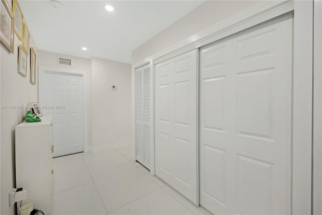 hallway with light tile patterned floors