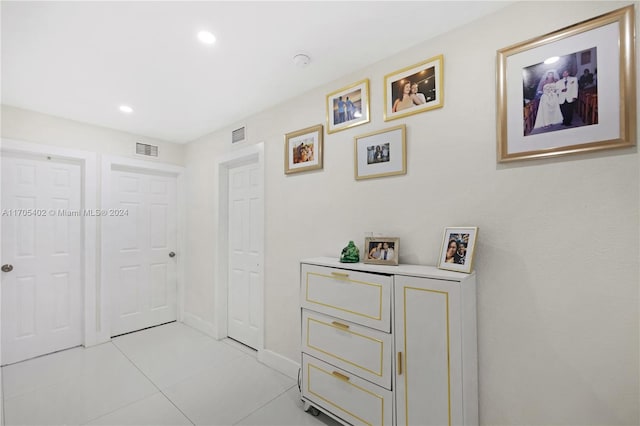 corridor featuring light tile patterned floors