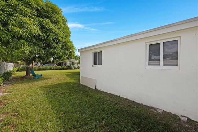 view of home's exterior featuring a lawn