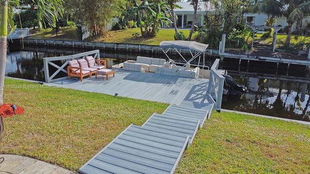 view of dock featuring a yard and a water view