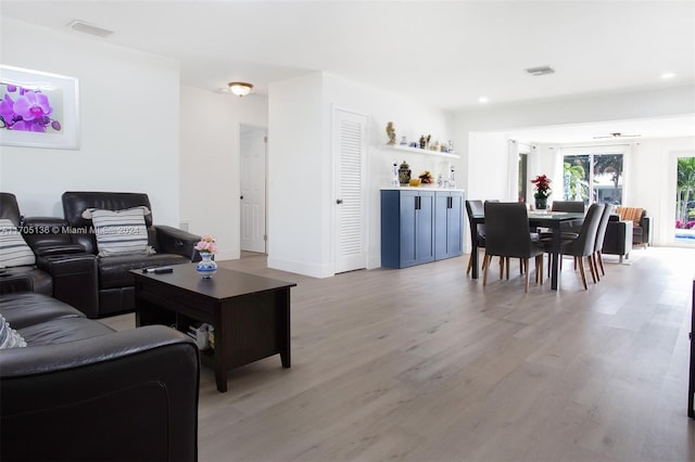 living room with light hardwood / wood-style flooring