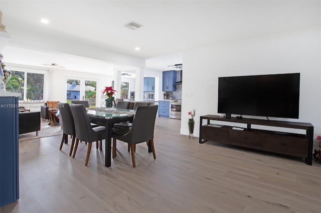 dining area featuring ceiling fan and light hardwood / wood-style flooring