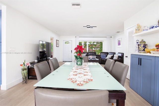 dining area with light hardwood / wood-style flooring