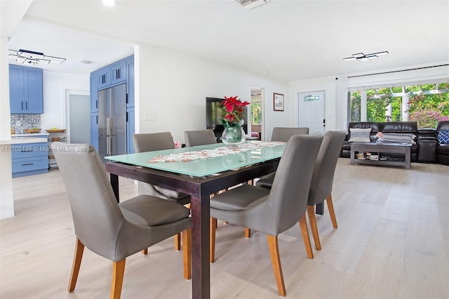 dining area with light hardwood / wood-style flooring