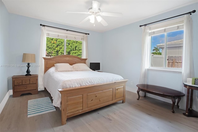 bedroom featuring ceiling fan and light wood-type flooring