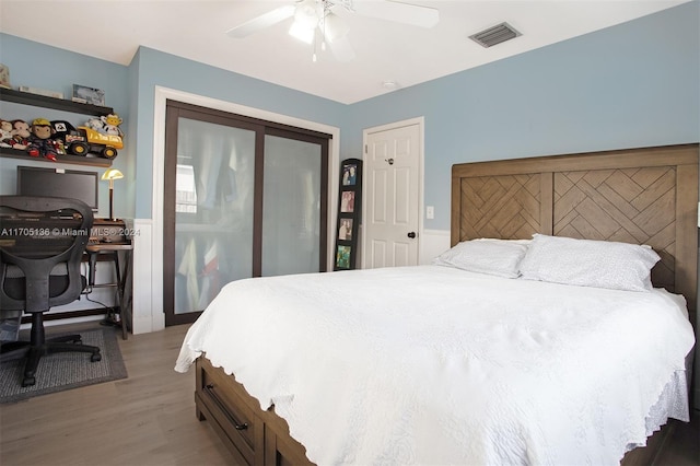 bedroom featuring light hardwood / wood-style flooring and ceiling fan