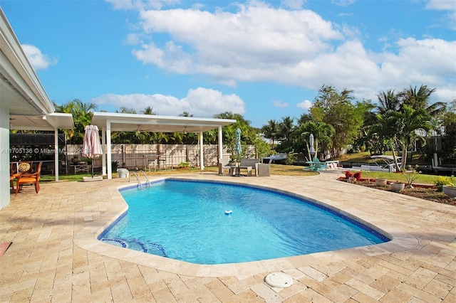 view of swimming pool featuring a patio area