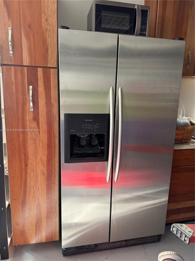 kitchen with stainless steel fridge with ice dispenser