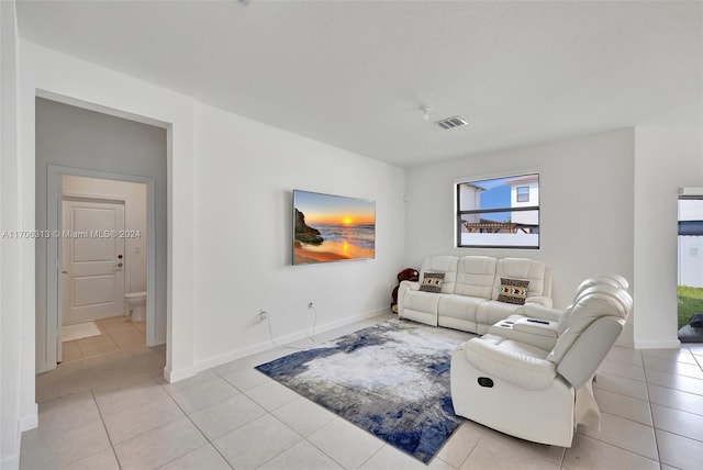 living room featuring light tile patterned flooring