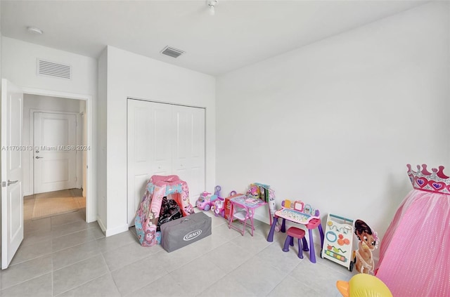 game room featuring light tile patterned floors