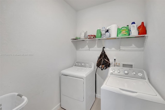 laundry room with washer and dryer