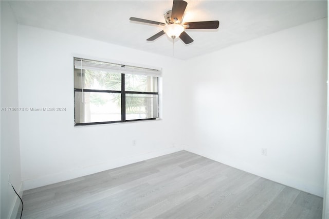 spare room featuring ceiling fan and light wood-type flooring