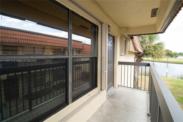 balcony featuring a water view