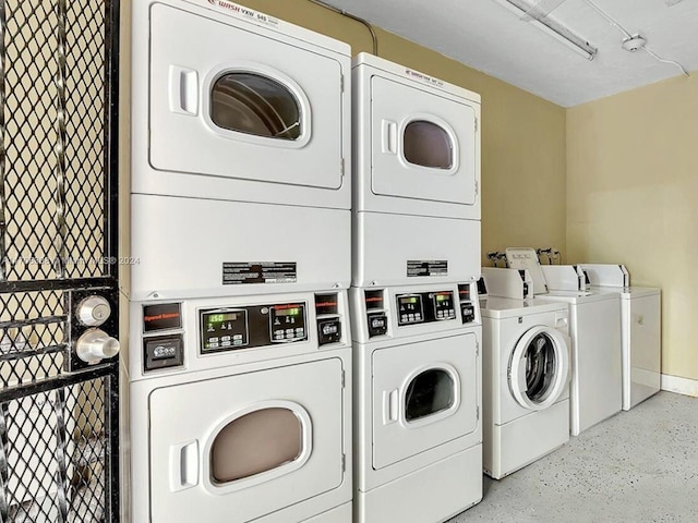 washroom with stacked washer / drying machine and washer and dryer