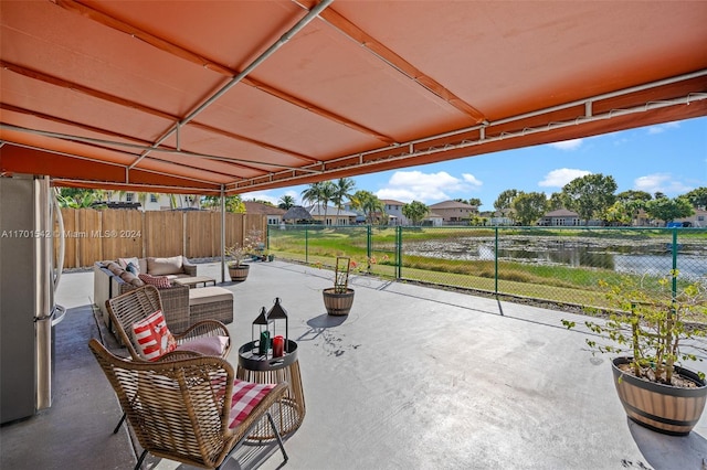 view of patio with a water view and an outdoor hangout area