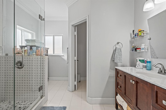 bathroom featuring tile patterned flooring, vanity, an enclosed shower, and crown molding