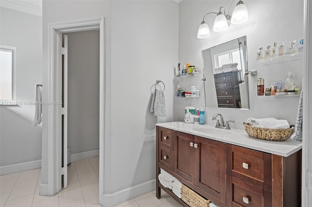 bathroom with tile patterned flooring, vanity, and ornamental molding