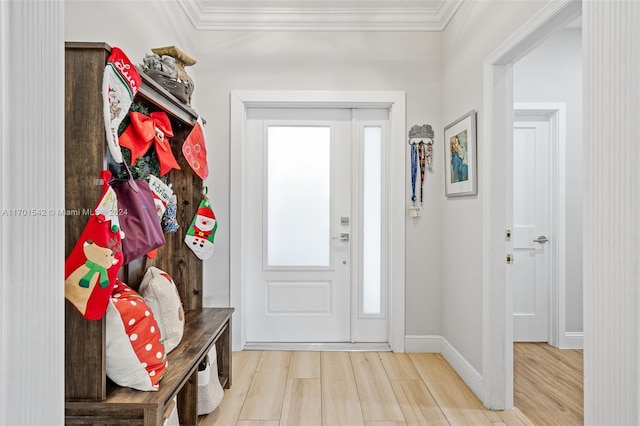 mudroom featuring light wood-type flooring and crown molding