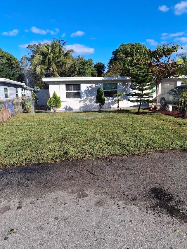 view of front of home with a front yard