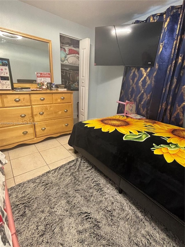 bedroom featuring light tile patterned flooring