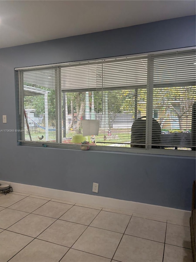 unfurnished room with light tile patterned floors