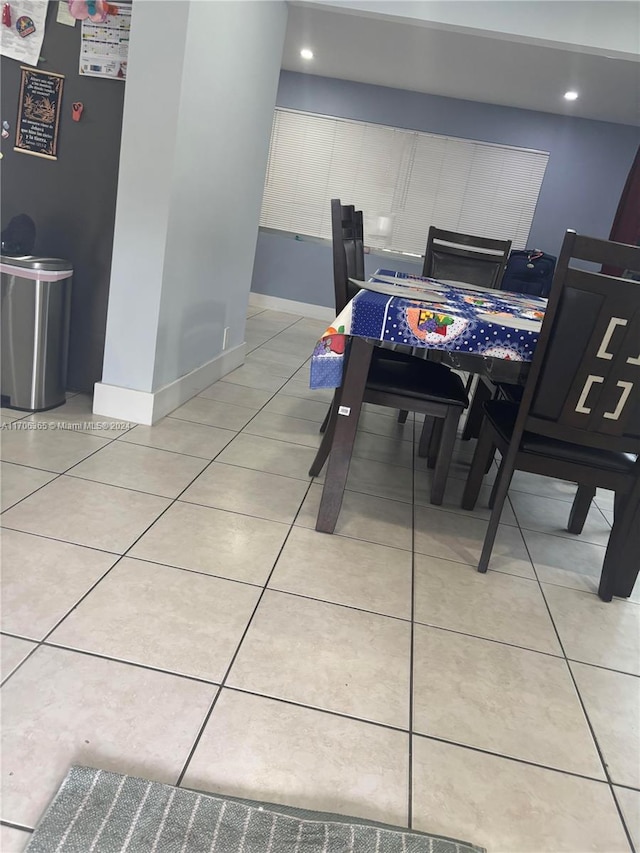 dining area with light tile patterned floors