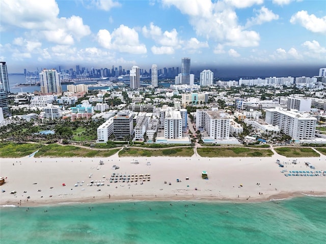 aerial view with a beach view and a water view