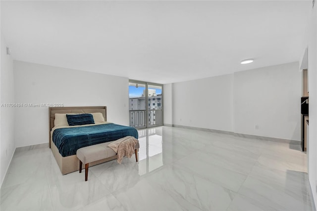 bedroom featuring expansive windows