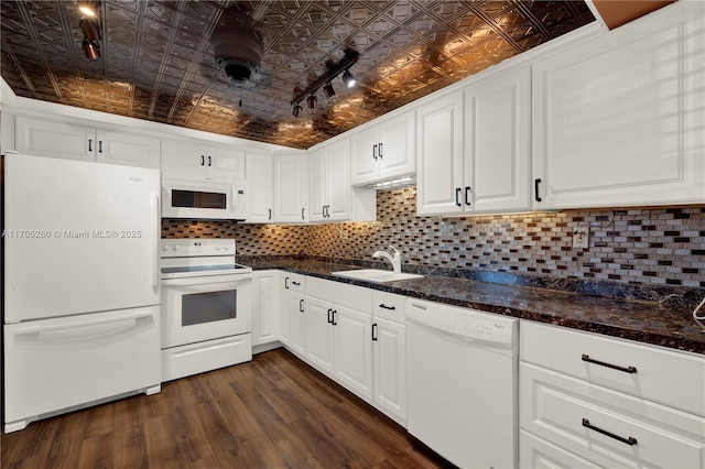 kitchen featuring an ornate ceiling, tasteful backsplash, white cabinetry, a sink, and white appliances