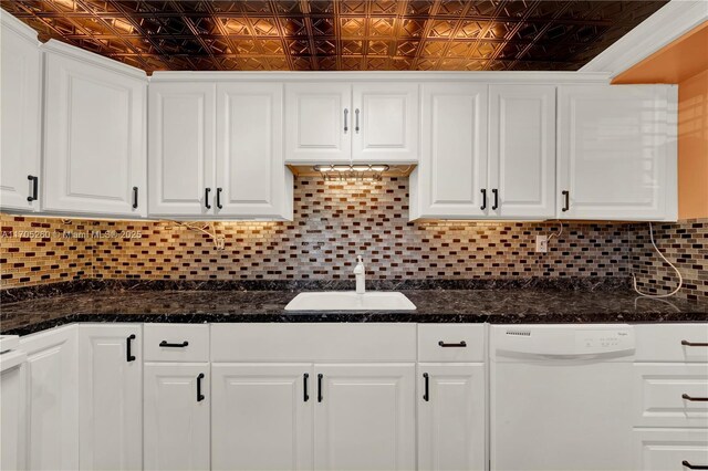 kitchen with dishwasher, an ornate ceiling, and white cabinetry