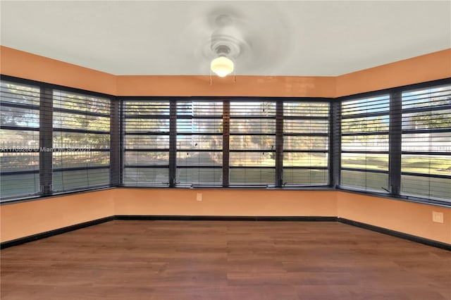 unfurnished sunroom with plenty of natural light