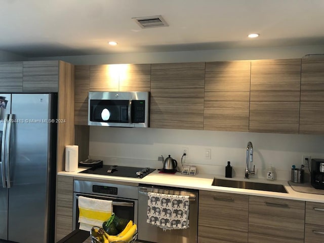 kitchen featuring sink and appliances with stainless steel finishes