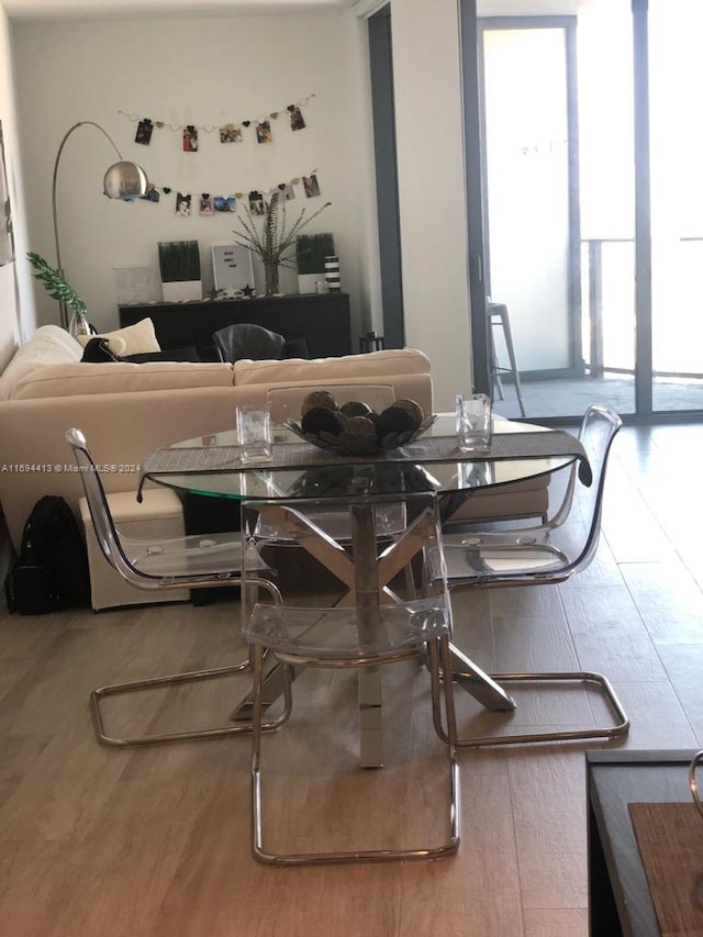 dining space featuring wood-type flooring