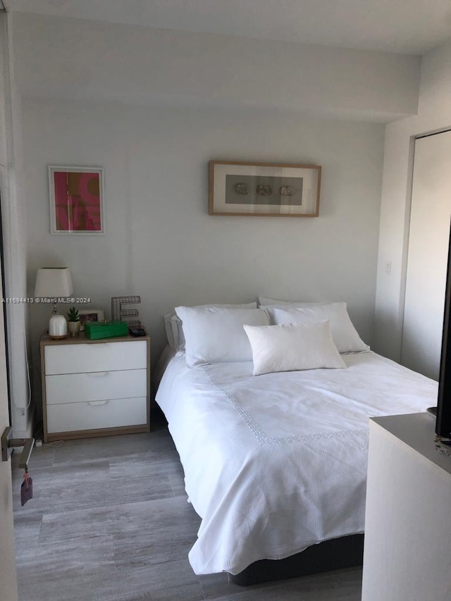 bedroom featuring hardwood / wood-style floors