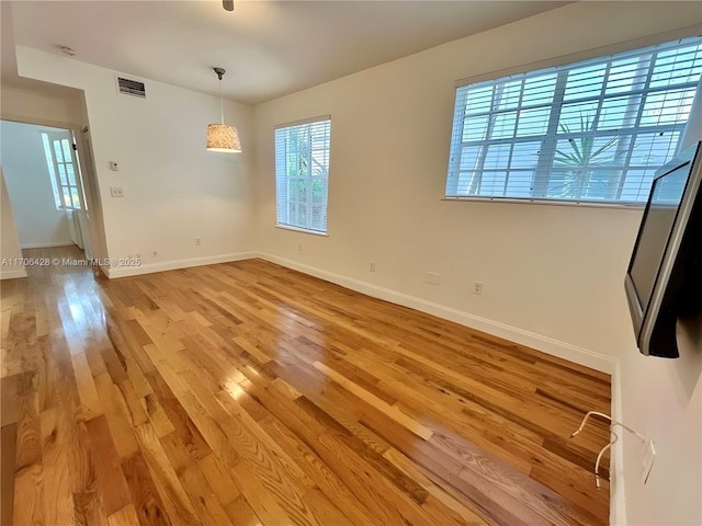 unfurnished room with light hardwood / wood-style floors