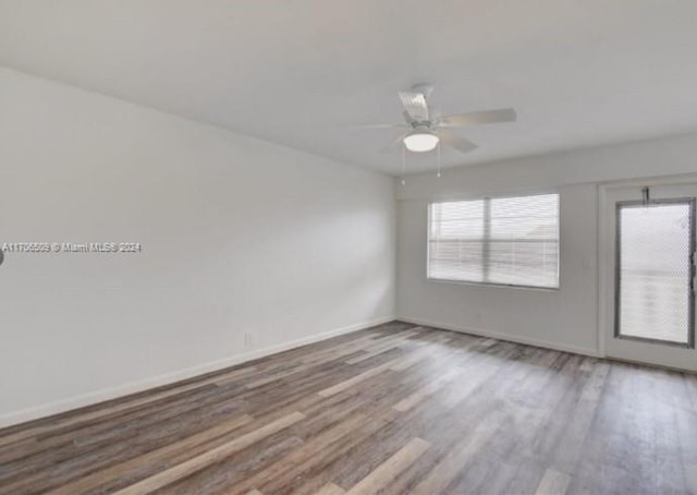 spare room featuring ceiling fan and wood-type flooring