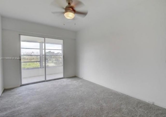 unfurnished room with carpet and ceiling fan