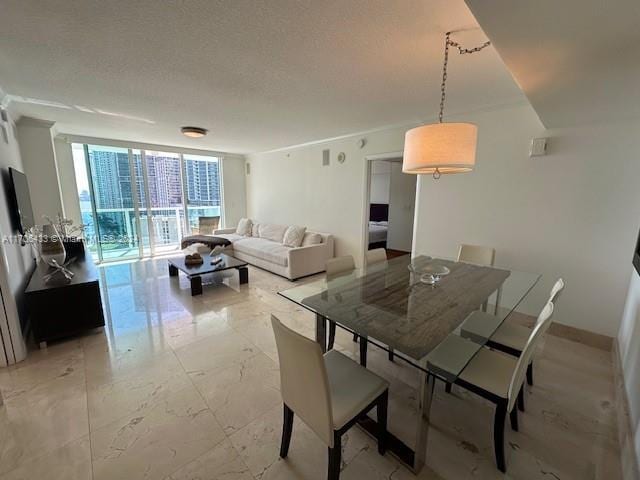 31 SE 5th St Unit 1908, Miami, FL 33131 - dining area featuring a textured ceiling and light marble finish floors