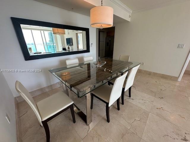 31 SE 5th St Unit 1908, Miami, FL 33131 - dining area with ornamental molding and light marble finish floors
